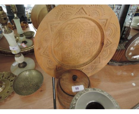 A treen tea caddy and carved charger