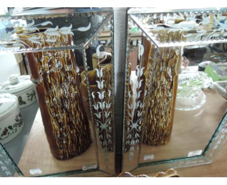 A pair of vintage style wall mirrors