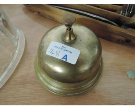 A vintage hotel reception desk bell with a classic look