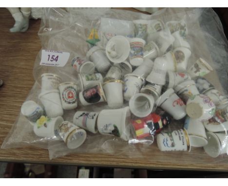 A selection of collectable and novelty thimbles ceramic and metal
