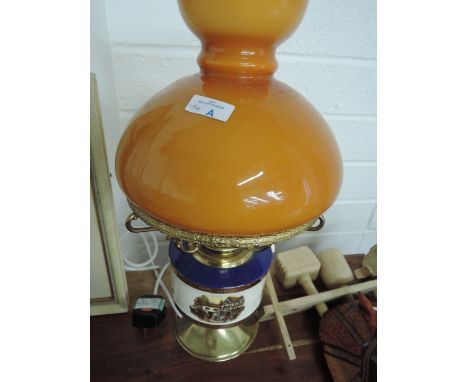 A brass table lamp with ceramic faux smoked glass shade