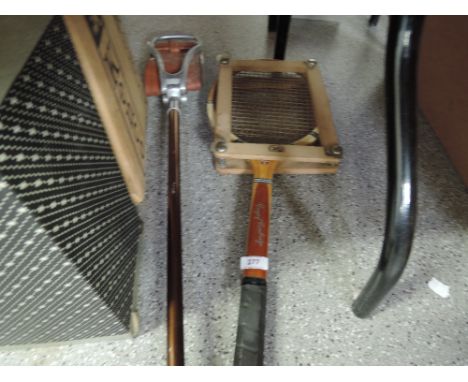 A vintage Grays tennis racquet and shooting stick