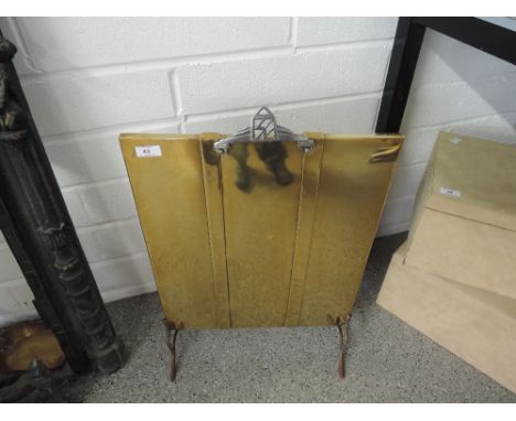 A brass fire screen 
