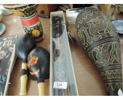 A selection of indigenous tribal instruments including mini didgeridoo, rain stick and drum