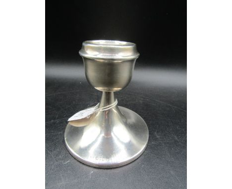 A silver weighted candlestick&nbsp;