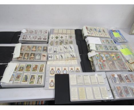 A large cigarette card collection to include many full sets dating back to the early 1920's to include Shell, BP, Will's, Pla