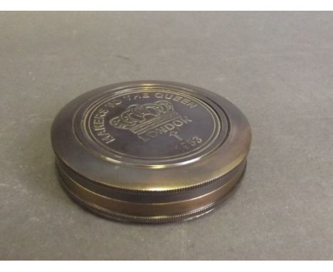A brass pocket compass inscribed 'Makers to the Queen, London 1953', marked with a poem by Robert Frost to interior, 3'' diam