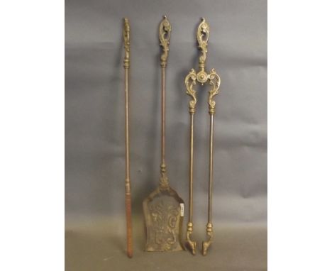 A set of brass fire irons and tools with ornate handles, 27'' long