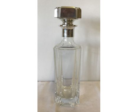 A modern decanter with 925 silver collar and stopper. Art Deco Style. Small chip to one corner. 