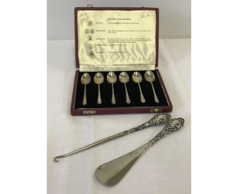 A cased set of 6 silver coffee spoons together with silver handled boot hook & shoe horn. Spoons hallmarked Sheffield 1968, m