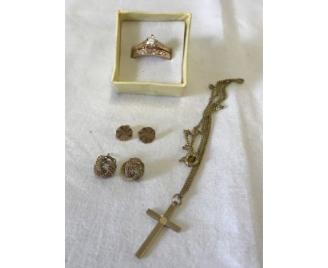A small collection of gold and gold tone jewellery. To include 2 pairs of earrings and a 9ct gold cross with engine turned de