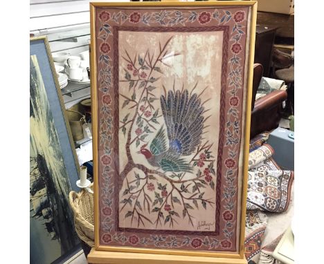 A framed print on fabric signed