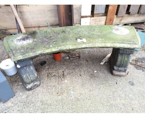 A stone garden bench.