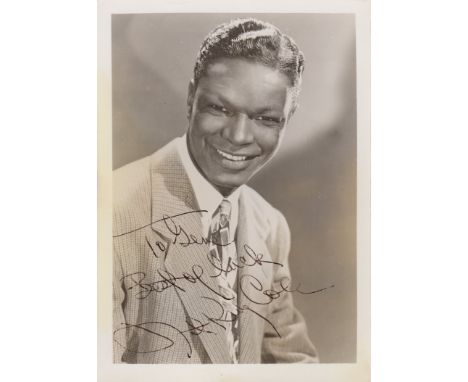 COLE NAT KING: (1919-1965) American Singer & Jazz Pianist. Vintage signed sepia 5 x 7 photograph of Cole in a head and should