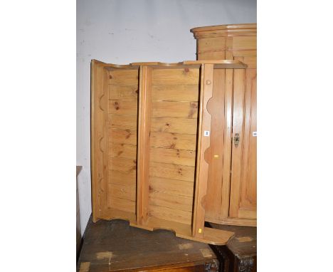 A stripped pine hanging shelf unit, 96cms wide.