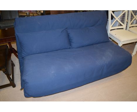 A sofa bed upholstered in blue material.