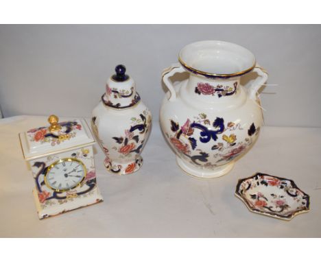 Masons ironstone 'Mandalay' pattern ceramics comprising: a two-handled vase, a clock, a dish, and a covered urn pattern vase.