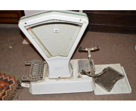 A set of butcher's scales, by W. & T. Avery, covered in white enamel.