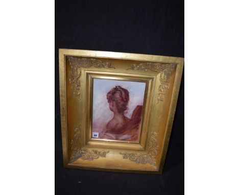 A painting on satin, by Gordon Robinson - portrait of a lady with her head turned, signed to label verso, in gilt frame.