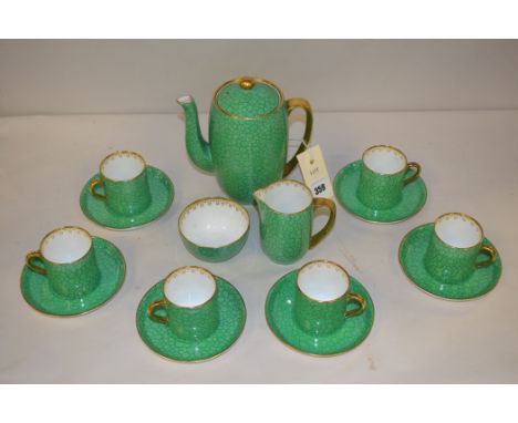 A Foley china coffee service, comprising: coffee pot, cream, sugar, six coffee cups and saucers, in green glaze with gilding 