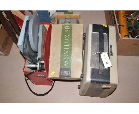 A Philco reel-to-reel tape recorder; a Zeiss Ikon Movilux 8B projector; a film pre-scanner; and a Bell & Howell projector.  (