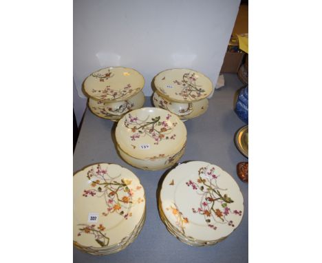 CFH-GDM Limoges dessert service, comprising: twelve plates, four low and two high comport with bird perched amongst flowers a