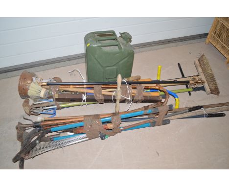 Two bundles of mainly garden tools.