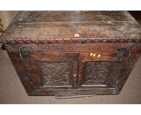 A 19th Century carved and stained oak cabinet, decorated with acanthus design, enclosing a small shelf to interior, 95cms wid