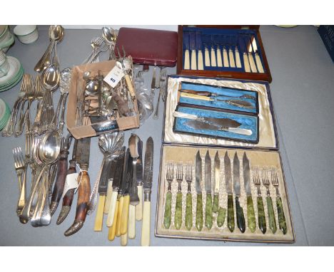 A quantity of cutlery; a three piece antler handled carving set; fruit knives and forks by R. Drummond & Sons, Oban, with sto