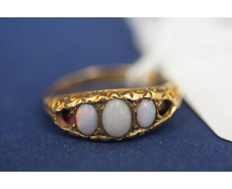 An opal ring on 18ct. yellow gold shank, size K, (missing stones).