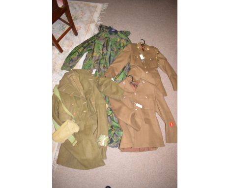 A military trench coat; a British Infantryman's camouflage waterproof set of overalls; and two military dress uniforms.