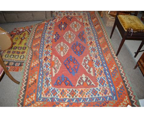 A first half 20th Century Kilim runner, with medallion design to field and multiple border, 270cms long.