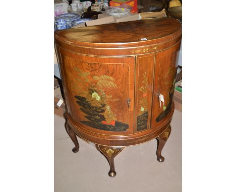 A burr walnut and polychrome lacquer chinoiserie decorated bowfront cabinet, enclosing glazed shelf, 79cms wide.