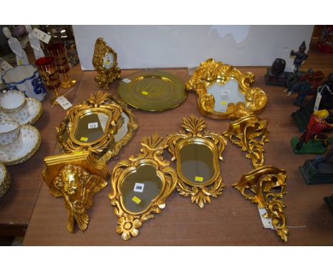 Assorted mirrors with gold painted frames, a history cast clock and other items.