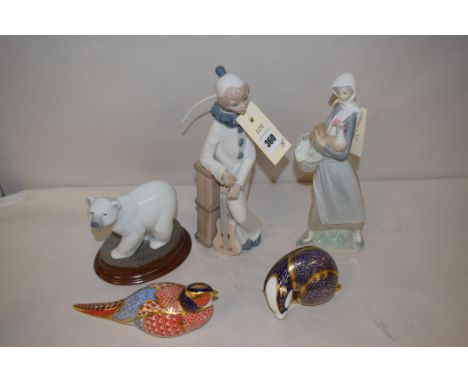 A Lladro ceramic polar bear; a Lladro 'Daisa' figure; Royal Crown Derby paperweights in the form of a badger and a pheasant; 