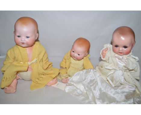 Armand Marseille dolls, to include: a bisque head doll 351./31/2k., with composition body; another small 331.2.k; and a compo