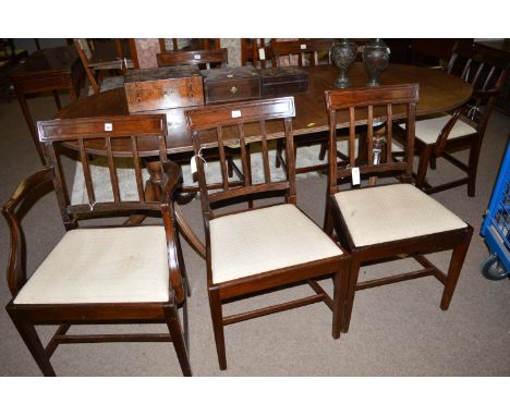 A set of six early 19th Century mahogany dining chairs, comprising two carver chairs and four single chairs, each with curved