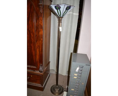 A modern Tiffany style standard lamp with stained glass shade.