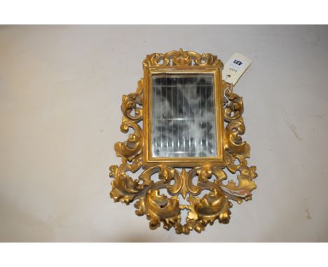 A gilded wooden framed mirror, with carved acanthus leaf decoration.