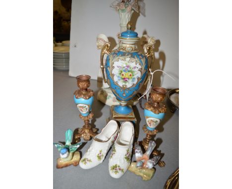 A ceramic table lamp with three women in a ring; a Continental floral painted covered vase, with a pair of similar candlestic