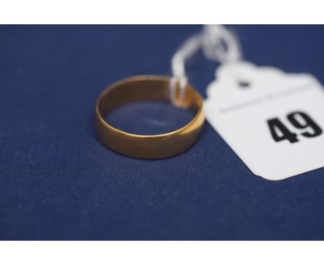 An 18ct. yellow gold wedding band, ring size R, 3.6grms.