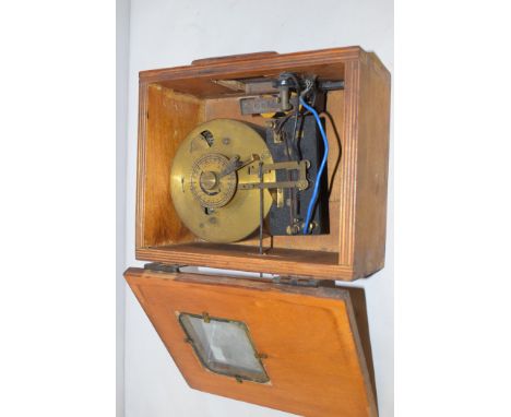 An early 20th Century pigeon racing clock, in wooden case.
