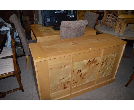 A Zone Furniture light coloured wood and burr wood paneled extending dining table, sideboard and four chairs, the side board 