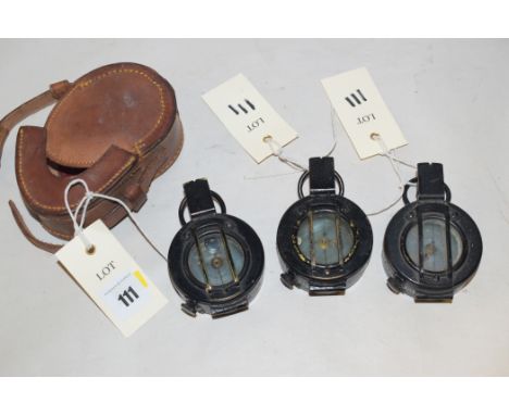 Military hand held bearing compass, by TG Co. Ltd. London, 1942 Mk III in leather case; another similar bearing compass witho