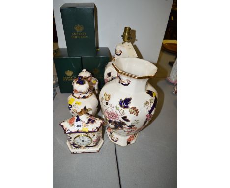 Masons 'Mandalay' pattern clock; covered vase; and tea caddy, all boxed; together with a baluster vase; and a table lamp (unb