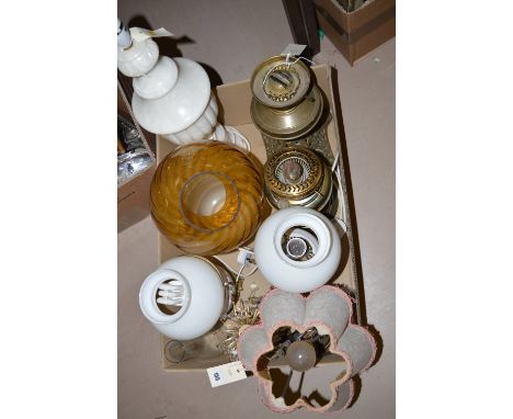 A collection of modern electric light fittings, two brass lamps one converted to electric and one still a brass lamp.