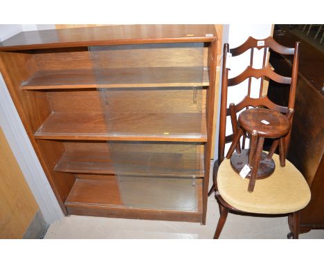 A mid 20th Century mahogany bookcase with sliding glazed doors, 91.5cms wide; an Ercol ladder back single dining chair; and t
