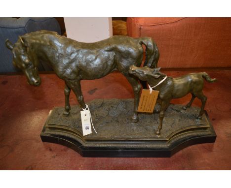 A patinated bronze mare and foal group, on naturalistic base and marble plinth.NB: Originally purchased from The Bronze Galle