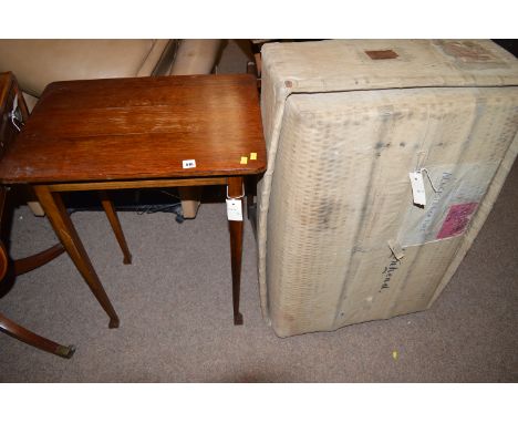 A 20th Century stained oak rectangular occasional table, 56cms wide; and a stained oak stick and umbrella stand; and a wicker