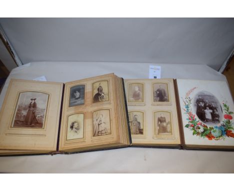 Two Victorian photograph albums containing portrait photographs, cartes de visite and cabinet cards.